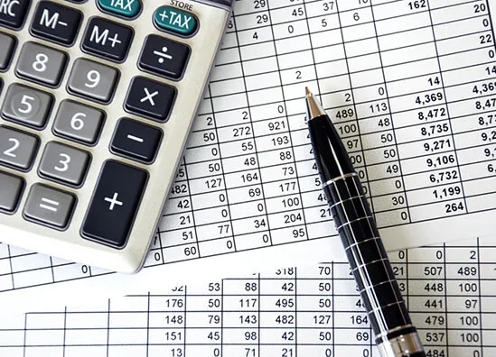 Vraj Fund Sector team working on financial planning in the office